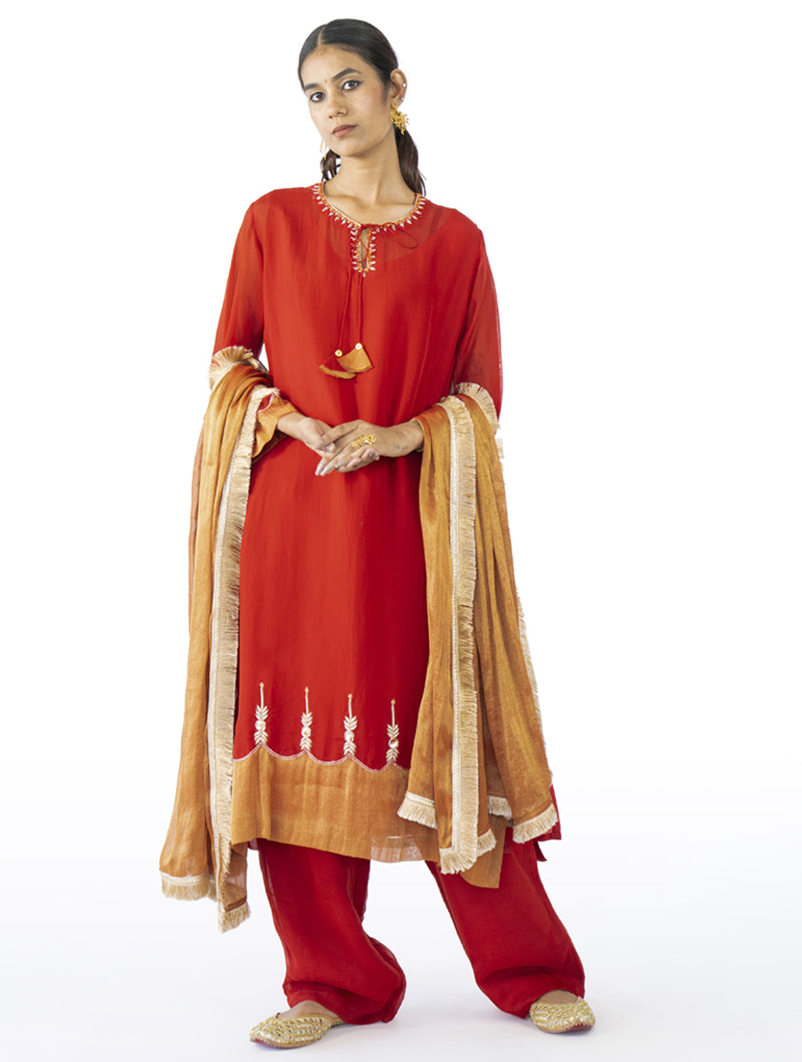 Red organza kurta set with tissue appliqué, kasab, zardosi embroidery, and a matching dupatta by