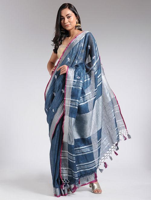 Agean blue embroidered linen saree with silver and pink border, floral butties, available at the online store of Sonal Kabra