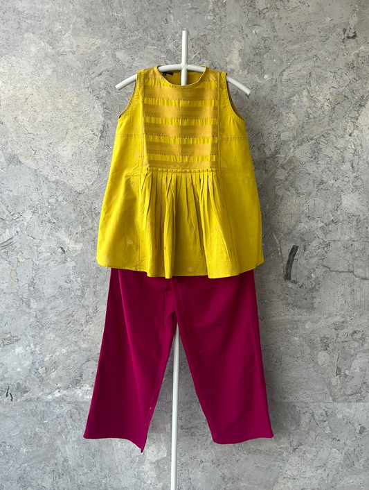 Yellow sleeveless cotton top with lace yoke and scalloped edges by Indian designer Sonal Kabra – lightweight summer wear from Sunlit Stories collection.