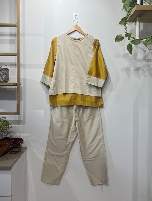 Cotton silk cord set in ochre and ivory by Indian designer Sonal Kabra, lightweight summer wear from the Sunlit Stories collection.