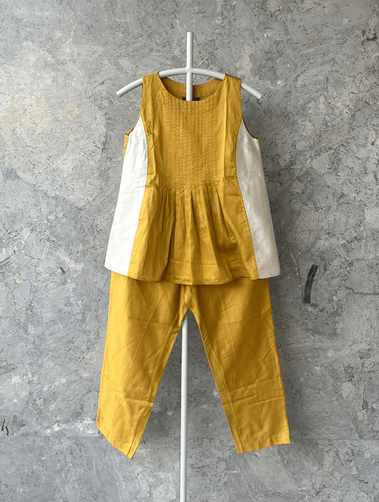 Sonal Kabra cotton silk cord set in ochre and ivory, sleeveless top with pants, Indian designer summer wear from the Sunlit Stories collection.