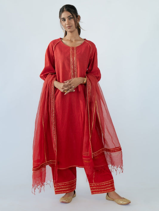 Coral Red Kota Doria Dupatta with black thread and sequin lace, golden gota stripes, and a zari-bordered palla – a handcrafted Indian designer piece.