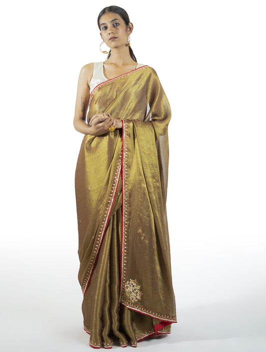 Brown tissue saree with zardosi embroidery, tikki, moti, and kasab highlights – handcrafted Indian designer wear by Sonal Kabra.