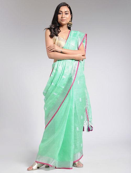 Sustainable linen fabric, mint saree with zari work, breezy material, bollywood vibes available on social media as well